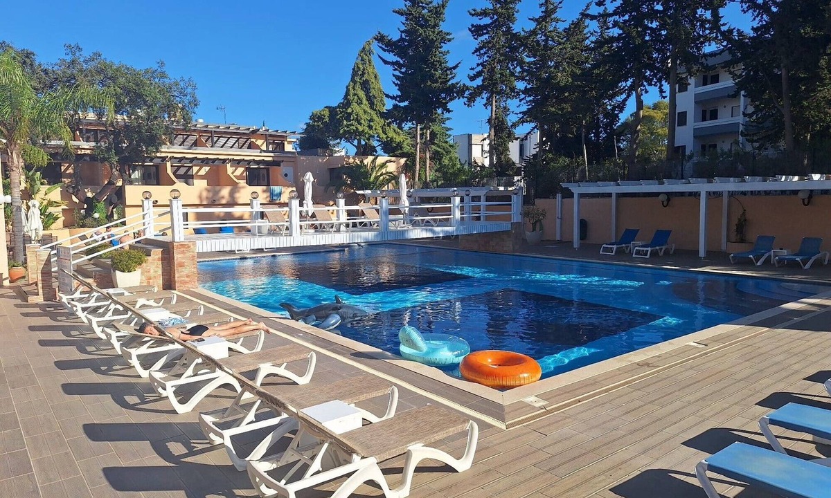 Santa Eulalia Apartment | Apartment 'Sun and Serenity' with Shared Pool, Shared Garden and Wi-Fi