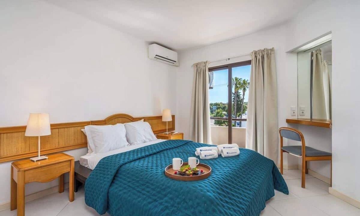 Alpouvar Apartment | Sunny Flat with a Balcony & Pool by HostWise