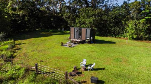 Maleny House | White Jacaranda Tiny House by Tiny Away