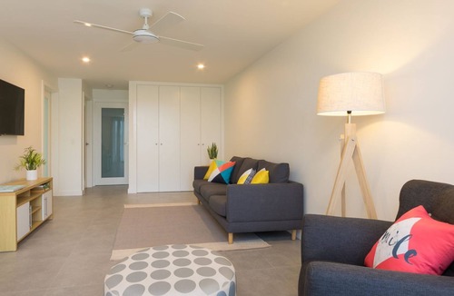 Woolgoolga Apartment | Absolute beachfront location, king size bed to relax and recover.Lock up garage