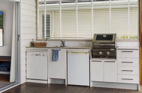 Wamberal Bed & Breakfast | Charming King Bedroom - Pool View - Walking Distance to Beach & Golf Course.