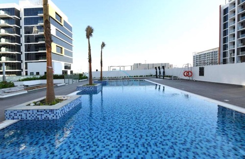 Nad Al Sheba Apartment | Chic Studio with a Community-Facing Balcony,Just Minutes by Car from Sobha Mall