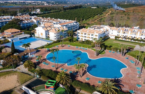 Cabanas Apartment | Golden 1 BDR Flat W/Balcony & Pool by LovelyStay