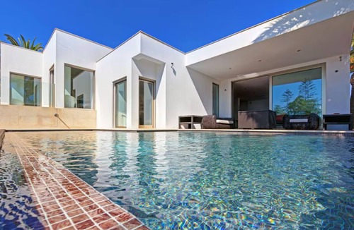 Praia da Luz Villa | Modern beachfront villa with heated pool and jacuzzi, ideal for families