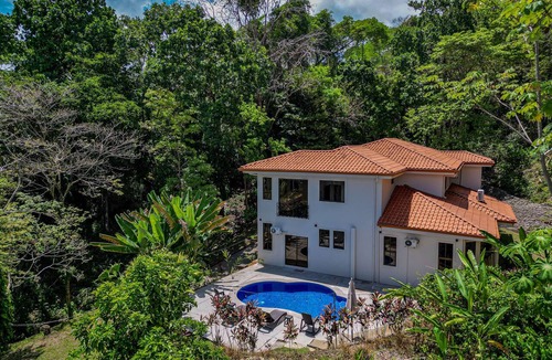 Camaronal House | Modern gated mountain villa in Tarcoles with a private pool, tropical surroundings, fast WiFi, Smart TVs, and spacious indoor living. Perfectly located near Carara National Park, Jacó, Playa Mantas, and Los Sueños Marina.