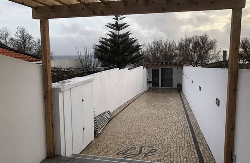 Ponta Delgada House | Oceanfront studio with private cobblestone patio and direct access to ocean pool