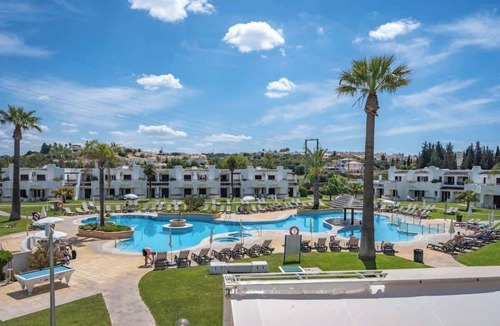 Alpouvar Apartment | Sunny Flat with a Balcony & Pool by HostWise