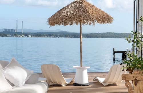 Bonnells Bay Apartment | The Boathouse- Unwind at this tranquil, absolute waterfront, luxury Boathouse nestled on the edge of