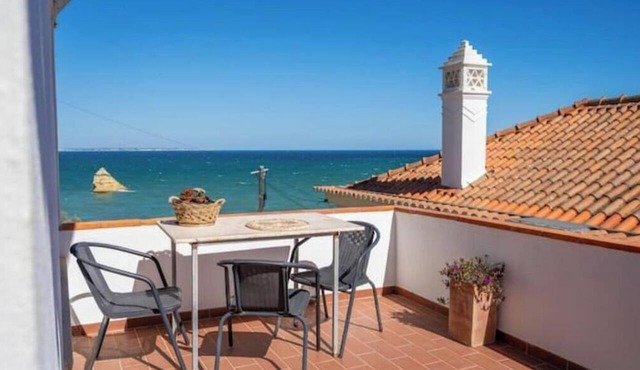 A charming, historic apartment with a terrace right on the beach