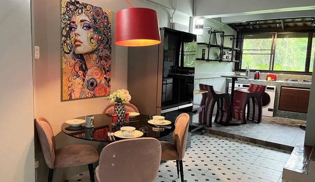 Chef’s kitchen-multiple balconies- eye popping art-this duplex has it all